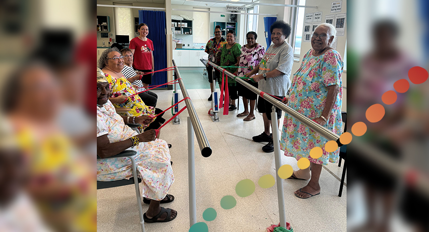 Group of elderly ladies doing exercises in a room.